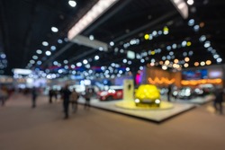 Abstract blurred image of people in cars exhibition show including activities and innovative automotive exhibitions at display in 42th Bangkok International Motor Show 2021 Nonthaburi, Thailand.