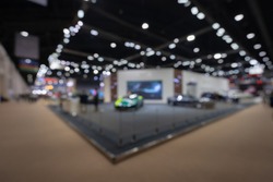 Abstract blurred image of people in cars exhibition show including activities and innovative automotive exhibitions at display. Concept blurred for background.