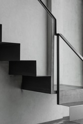 Stairway with black metal structure banister building architecture loft-style railings interior design contemporary. Modern home and living building steel stairway retro concept.