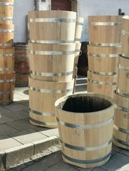 Old restored beer barrels used as flower pots.