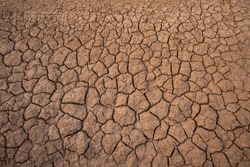 dry land in the dry season Drought, ground cracks, no hot water. Lack of humidity effect from global cracked soil in drought abstract nature background with cracked soil
