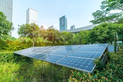 Ecological energy renewable solar panel plant with urban landscape landmarks