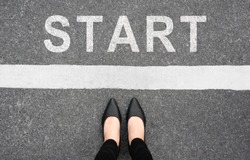 Start background, top view. Selfie of feet and legs in black high heels shoes on pathway. Businesswoman on starting line new beginning idea. Business challenge concept. Moving forward and future.