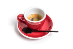 Espesso in a red cup isolated on a white background .A cup of espresso.  Coffee isolated on a white background  . 