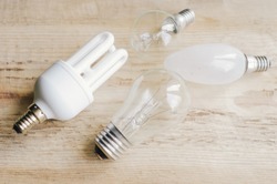 Three generations of light bulbs. Regular incandescent, energy saving fluorescent and LED isolated on white background with clipping path 

