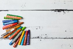 colored crayons with the inscription 