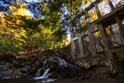 Waterfalls at the ruins of the Carbide-Willson Mill in Gatineau Park in autumn, Quebec, Canada