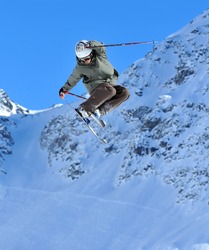 Ski Jumper performing  a tail grab