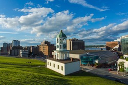 The iconic 120 year old town clock Halifax, an historic landmark of Halifax, Nova Scotia, Canada Downtown as seen from Citadel Hill overlooking the Town clock and business and residential buildings