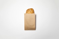 Fresh Bread in a brown kraft Paper Bag Mockup on white background.High resolution photo.