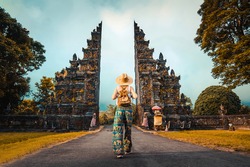 Woman with backpack exploring Bali, Indonesia. 