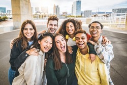 Multiracial group of friends taking selfie picture outdoors - Millennial people having fun on city street - International students smiling together at camera - Youth culture and community concept
