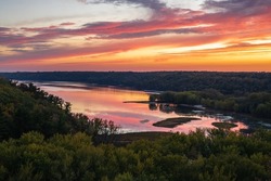 Scenic sunset overlooking the confluence of the Kinnickinnic and St. Croix rivers and delta at Kinnickinnic State Park in Wisconsin during autumn.
