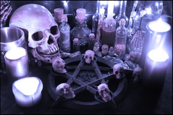 Necromancer's dark ritual with pentagram, candles and skulls