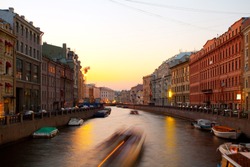 Sunset in the city on the river. (Fontanka River, St. Petersburg, Russia)