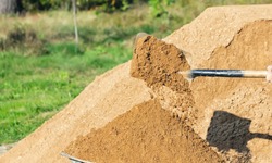Shovel with earth, pour sand, close-up