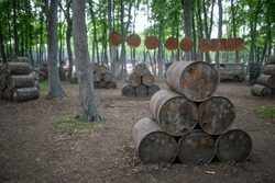 Polygon for playing paintball with barrels in the forest area