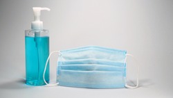 Coronavirus prevention medical facemask and hand sanitizer gel for hand hygiene corona virus protection.