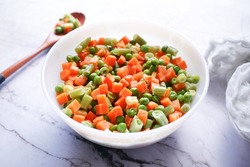 close up of corn, carrot and beans in a bowl,
