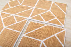 Acoustic panels with geometric pattern on wood texture