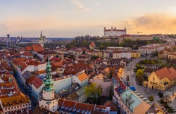 Beautiful aerial drone photo of Bratislava old town historical city center with Castle, St. Martin's Cathedral, Michael's Gate and UFO observation deck from above. Top view of capital of Slovakia.