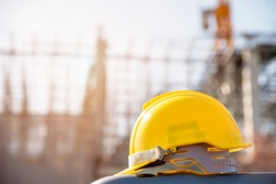 helmet in construction site and construction site worker background  safety first concept