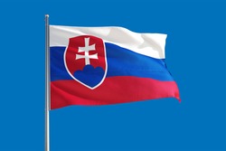 Slovakia national flag waving in the wind on a deep blue sky. High quality fabric. International relations concept.