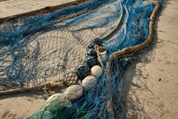 Fishing nets dry on shore.Pile commercial fish nets and gill nets.