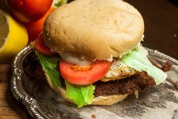 beef or chicken milanesa sandwich fried egg in breadcrumbs with 