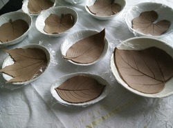 Making clay trays in the shape of leaves