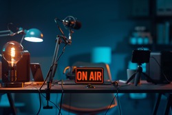 Live online radio studio desk with on air sign, entertainment and communication concept