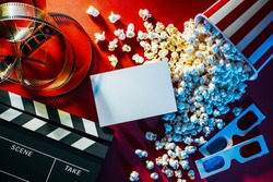 Blank cinema promo card or ticket, popcorn, filmstrip and clapper, movies and entertainment concept