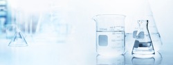 flask with clear beaker and glassware in medical science lab banner background