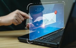 email marketing concept. Businessman using mobile phone or notebook to check email. electronic mail, e-commerce. newsletter email and protect your personal information from spam mail concept