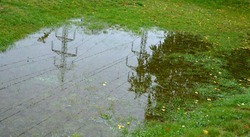 too compact and impermeable soil does not absorb water during rains and floods. a lake was created in the park in the lawn, which gradually infiltrates. damage to the lawn long flooding.  water push