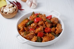 Kung Pao Chicken is typically Sichuan dish is chinese cuisine dish with chicken meat, chilli peppers, peanuts, sauces and onion.