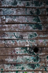 Old wooden slats painted green background