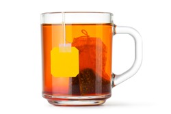 Glass cup with teabag. Isolated on a white.