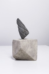 Creative arrangement, minimalistic home decor with sculpture made of river stone