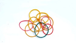 Multipurpose multi-colored rubber band pile isolated on a white background, colored elastic rubber band.