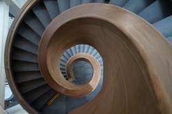 Top down view of the spiral staircase with wooden handle 