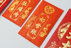 Red packet (Angpow) for Chinese pre-wedding gift ceremony (Guo Da Li), Chinese betrothal ceremony isolated on white background. Red packet Chinese font translation “Parental Gift”
