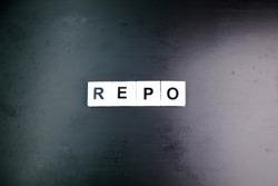alphabet letter REPO with dark background. business concept. another term for repurchase agreement. repurchase concept