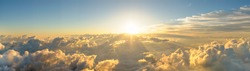 Panorama sunrise from the top of the mount Fuji. The sun is shining strong from the horizon over all the clouds and under the blue sky. good New year new life new beginning. Abstract nature background