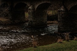 Dark Bridge with River in France