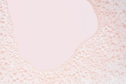 closeup Soap bubble foam on pink background 