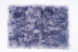 horizontal banner of a carpet with purple fur close-up. Design concept.Texture of a purple corner carpet. textile material macro close-up.The color of 2022 very peri. Flat lay, top view, copy space