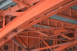 Construction of a red bridge with metal rivets in Copenhagen, Denmark