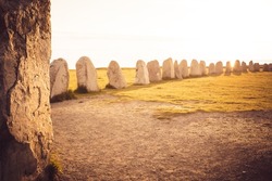 Ale Stones (Ales stenar) Is a megalithic monument of 59 large boulders and is 67 meters long. This landmark is located in Kåseberga, Sweden. Selective focus.