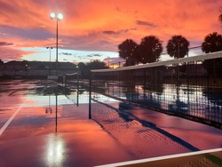 Spectacular sunset at pickleball courts in St Petersburg, FL just after it rained.